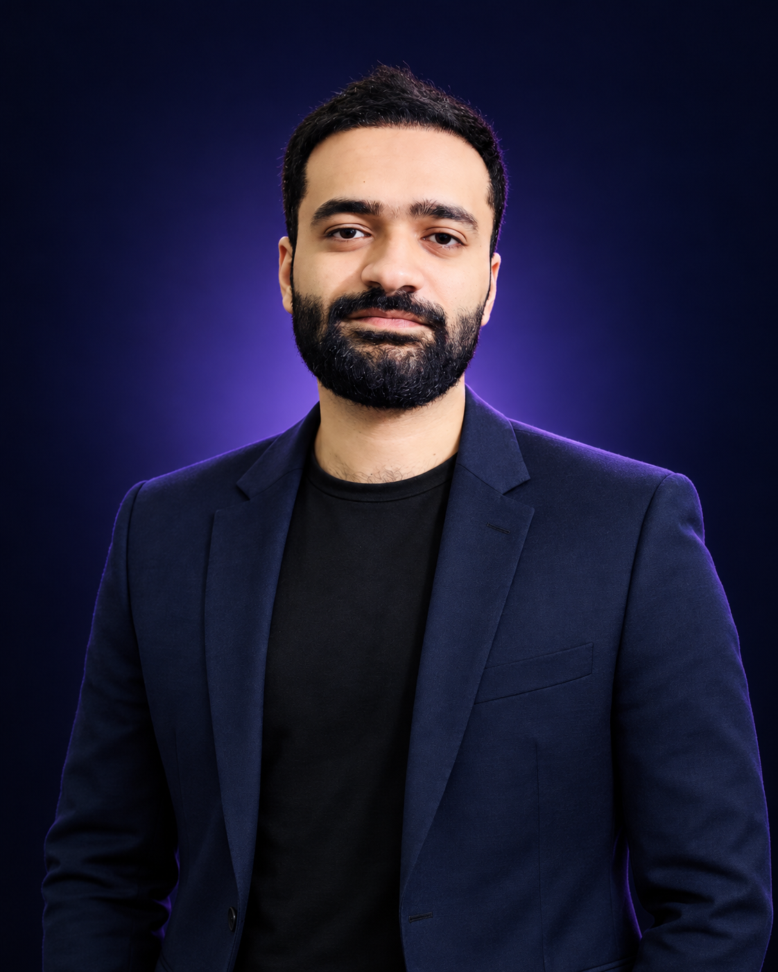 Professional portrait of Subhan Ali in a navy blazer